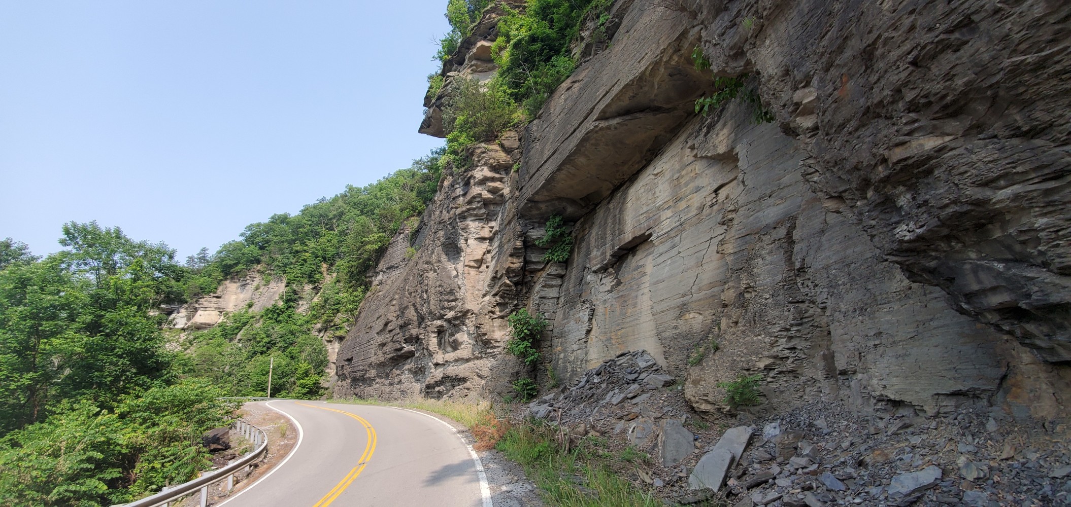 Rock walls, slowly falling off in layers, line the roads in this area.