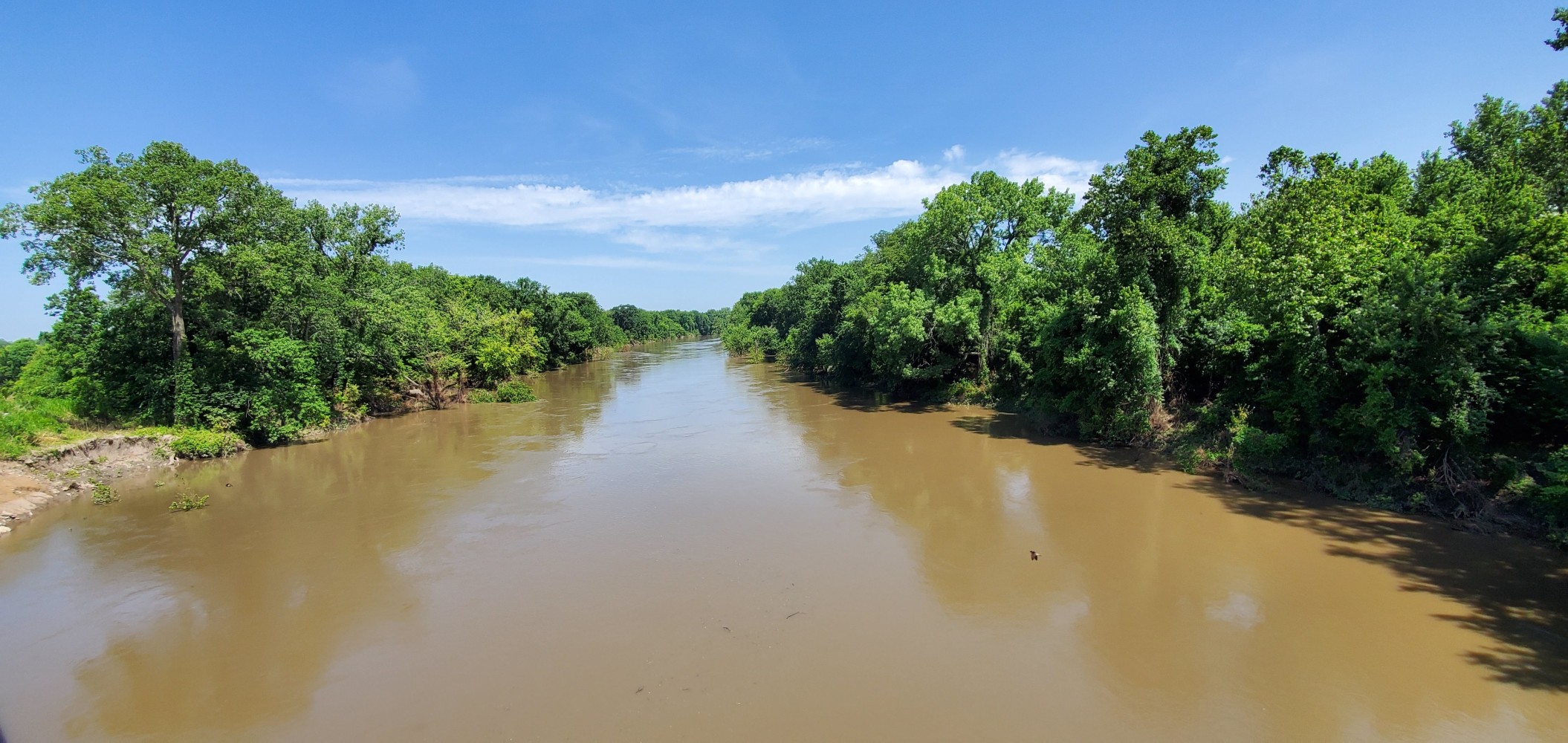 Neosho River. You can see submerged trees along the banks, so it must still be high.