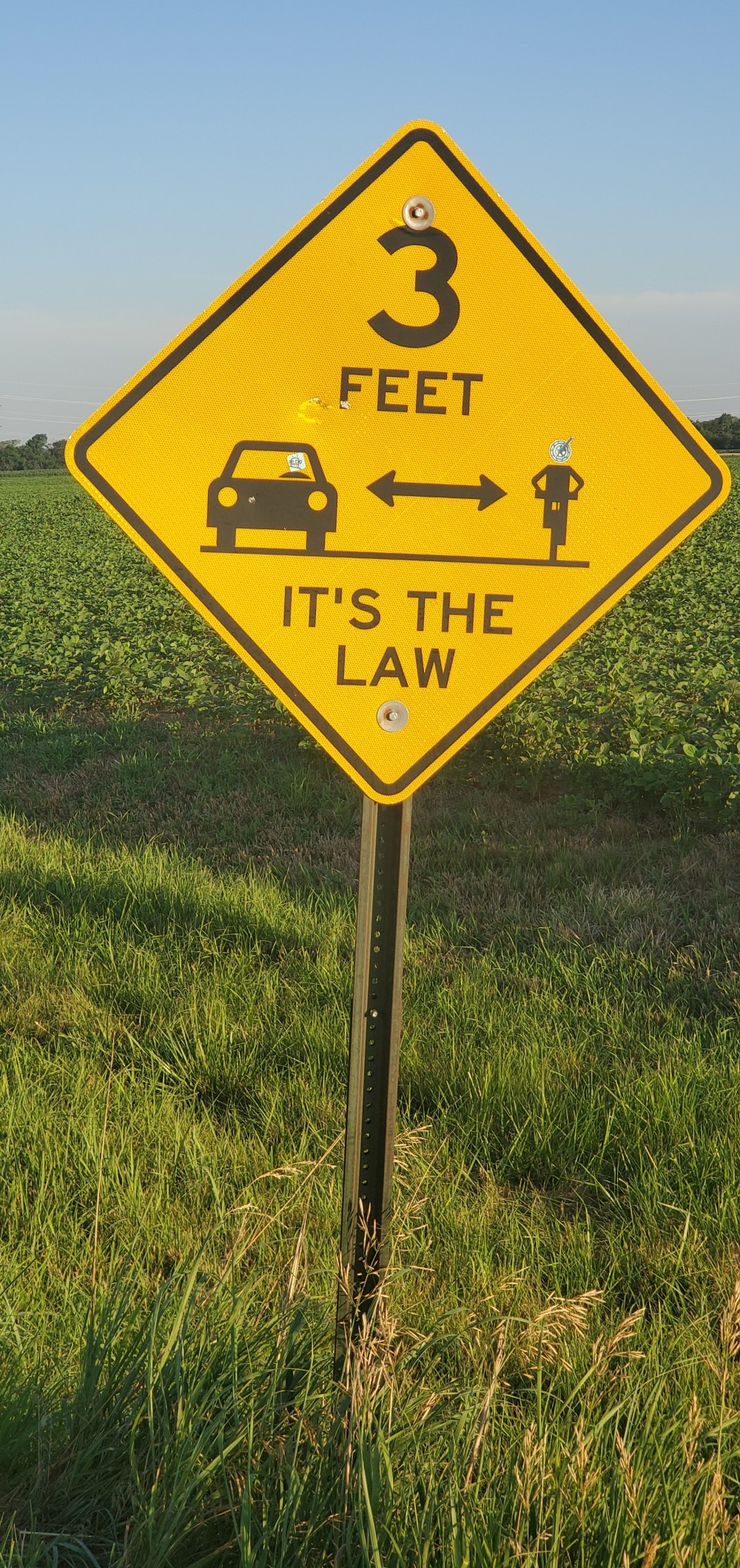 These signs are common in rural Kansas, at least on the TransAm, and I have had ZERO issues with drivers. So awesome!