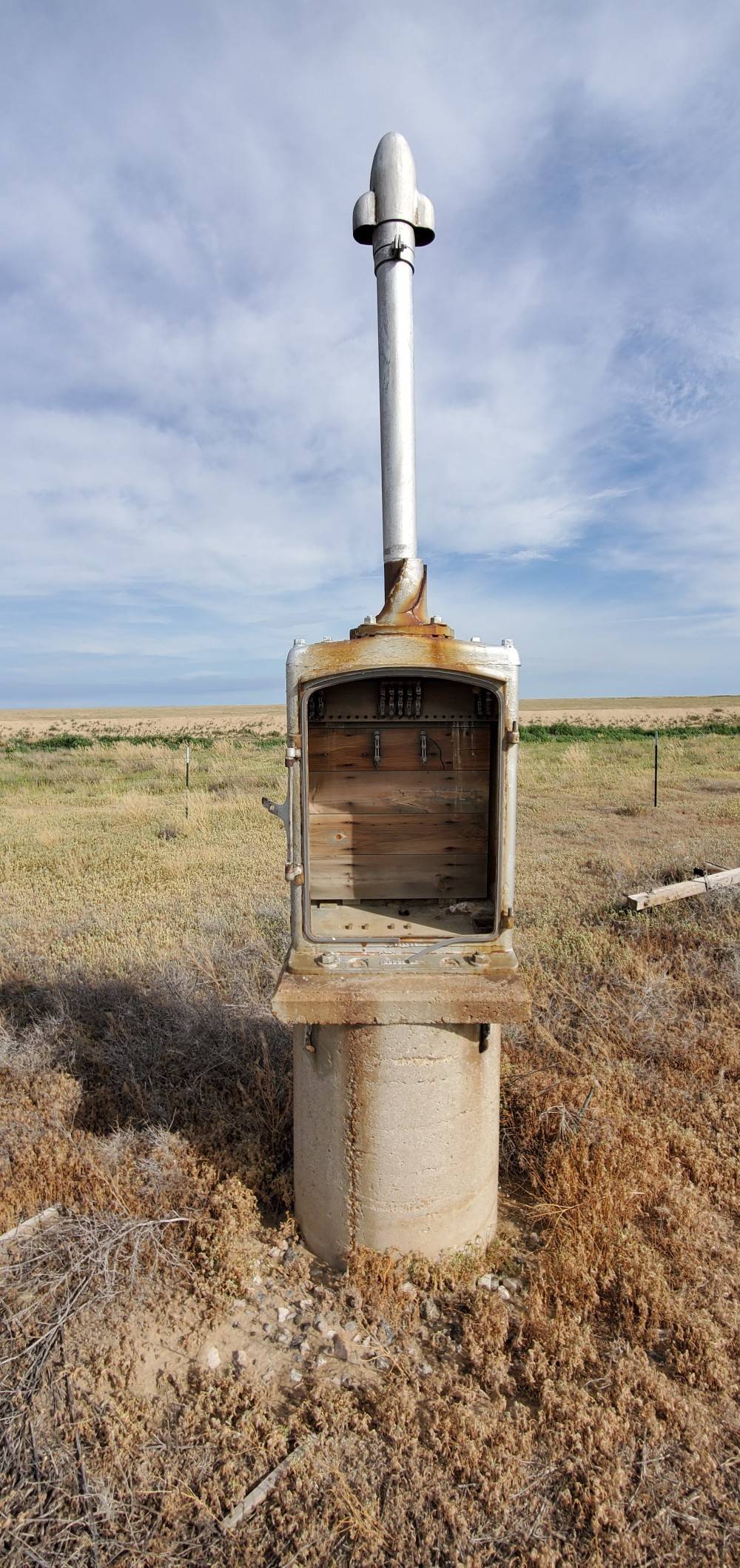 It took me a long time to realize what these are. Almost all of them have been gutted, and are missing their doors, but these are railroad lights, with the lights missing.
