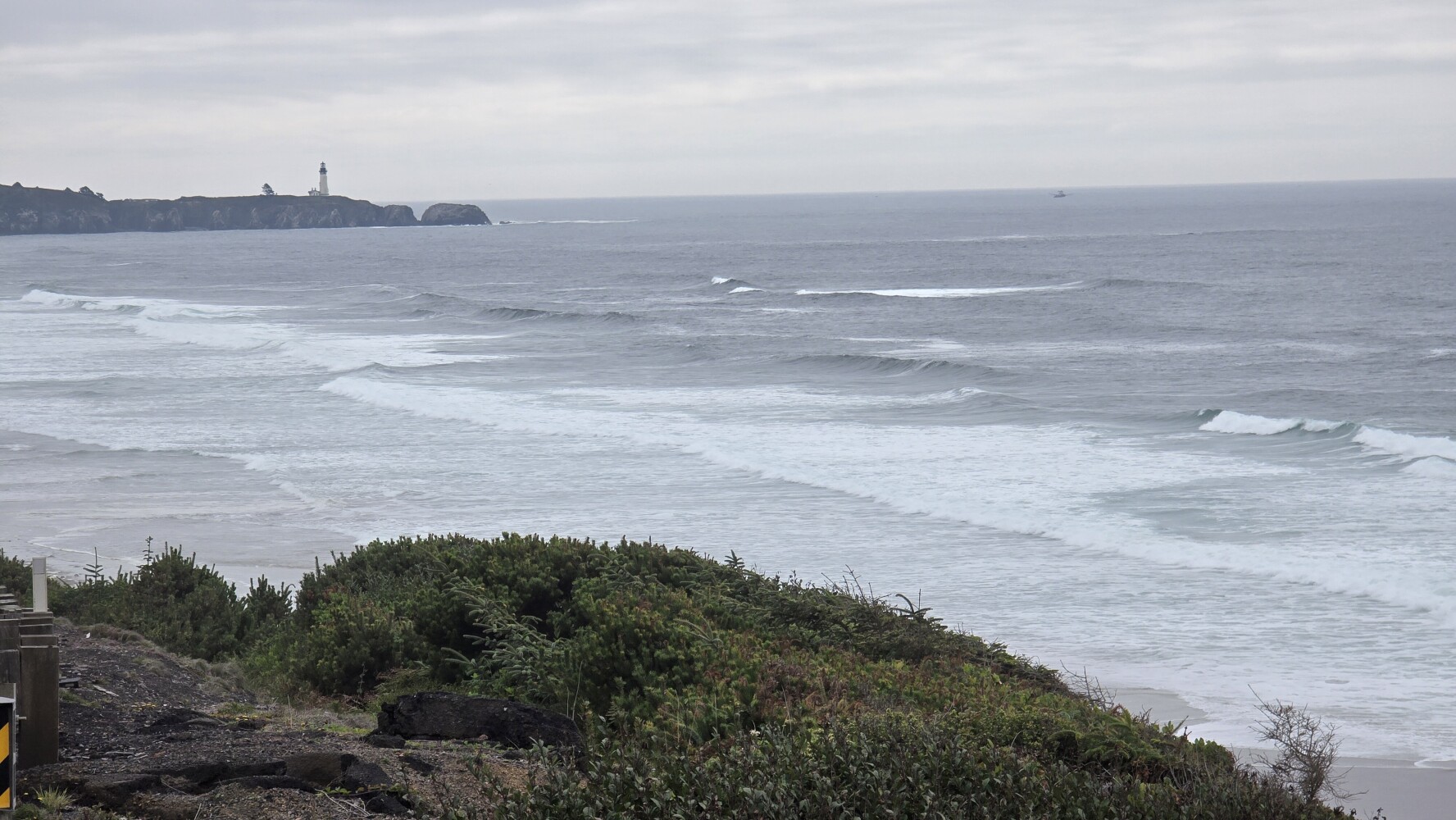 Moolack Beach, with Yaquina Head Lighthouse in the distance