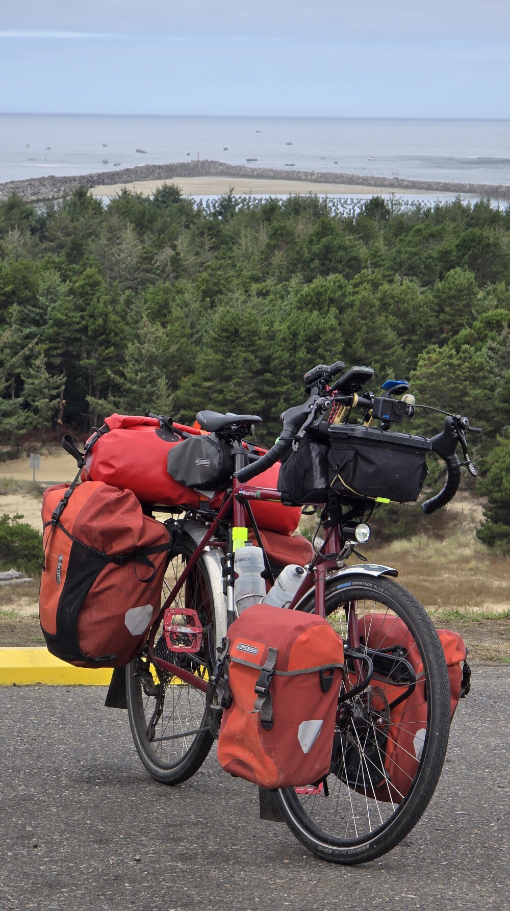 Another glamor shot of my bike with the Pacific Ocean and sand dunes in the distance.