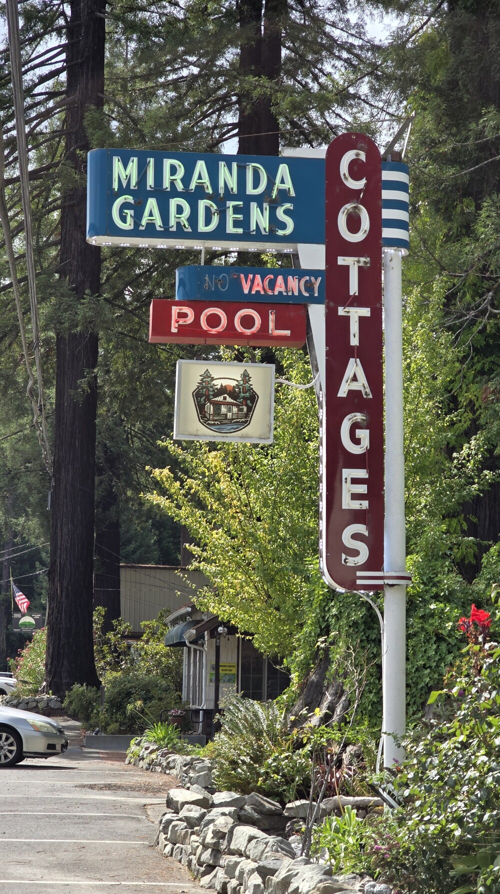 A cool old sign. The business seems to be open!