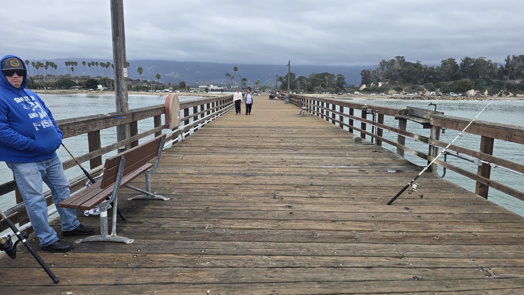 Fishing pier in Santa Barbara. The fellow on the left fishes there every day.