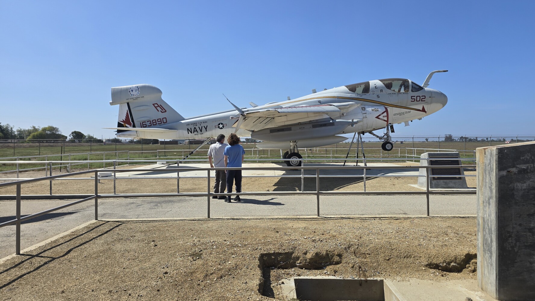 The elder man was telling the younger man all about this aircraft, a Navy EA-6B Prowler. The elder man flew one of these! I eavesdropped for a bit before talking to him. It was an electronic warfare plane.